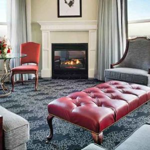 Bright and comfortable presidential suite with sofas and fireplace at the Embassy Suites by Hilton Portland-Downtown.