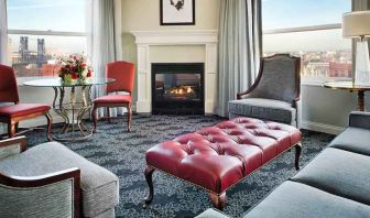 Bright and comfortable presidential suite with sofas and fireplace at the Embassy Suites by Hilton Portland-Downtown.