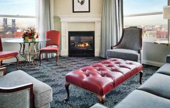 Bright and comfortable presidential suite with sofas and fireplace at the Embassy Suites by Hilton Portland-Downtown.