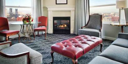 Bright and comfortable presidential suite with sofas and fireplace at the Embassy Suites by Hilton Portland-Downtown.