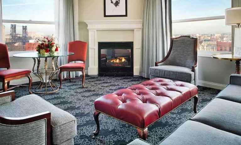 Bright and comfortable presidential suite with sofas and fireplace at the Embassy Suites by Hilton Portland-Downtown.