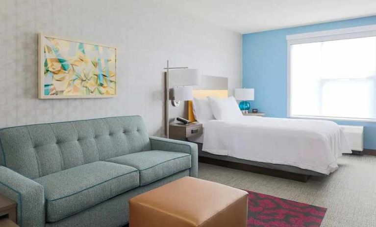 colourful king-sized bed with natural light at Home2 Suites by Hilton West Sacramento.