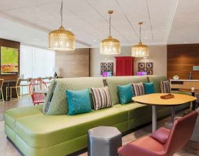 funky, colorful, and well-lit lobby and coworking space at Home2 Suites by Hilton West Sacramento.
