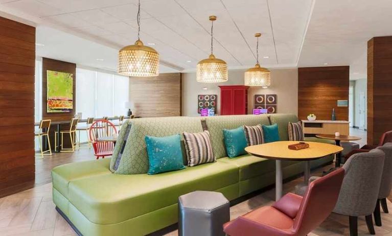 funky, colorful, and well-lit lobby and coworking space at Home2 Suites by Hilton West Sacramento.