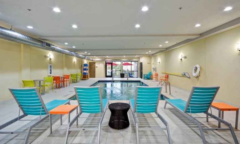 Relaxing indoor pool with seating area at Home2 Suites by Hilton Fort Worth Southwest Cityview.