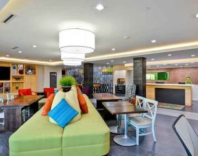 Funky, colorful, and well-lit lobby and coworking space at Home2 Suites by Hilton Fort Worth Southwest Cityview.