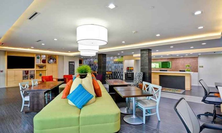 Funky, colorful, and well-lit lobby and coworking space at Home2 Suites by Hilton Fort Worth Southwest Cityview.