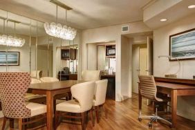 Desk, table and chairs in a presidential suite dining area at the Embassy Suites by Hilton San Diego-La Jolla.