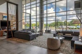 Beautiful lobby area with large windows and lounges perfect as workspace at the Hilton Franklin Cool Springs.