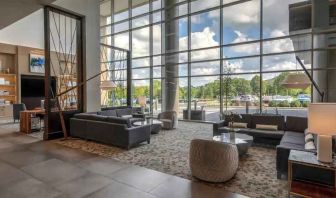 Beautiful lobby area with large windows and lounges perfect as workspace at the Hilton Franklin Cool Springs.