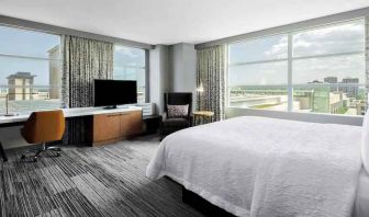 King suite with desk and large windows at the Hilton Garden Inn Chicago McCormick Place.