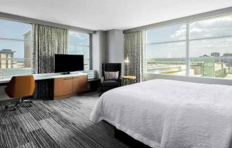 King suite with desk and large windows at the Hilton Garden Inn Chicago McCormick Place.