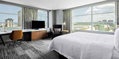 King suite with desk and large windows at the Hilton Garden Inn Chicago McCormick Place.