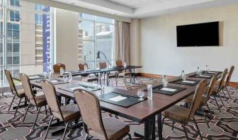 Small meeting room with screen at the Hilton Garden Inn Chicago McCormick Place.