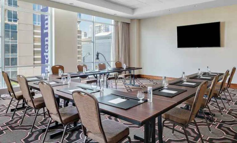 Small meeting room with screen at the Hilton Garden Inn Chicago McCormick Place.