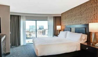 King bedroom with city view at the Embassy Suites by Hilton Minneapolis-Airport.