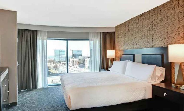 King bedroom with city view at the Embassy Suites by Hilton Minneapolis-Airport.