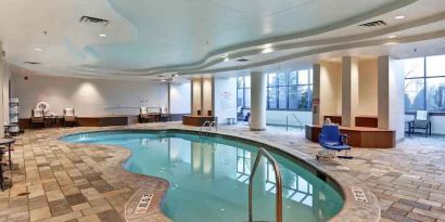 Relaxing indoor pool area at the Embassy Suites by Hilton Minneapolis-Airport.