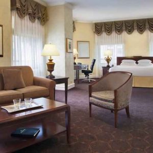 Spacious family room with king size bed and working station at The Drake.