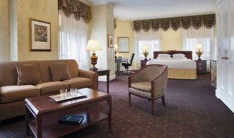 Spacious family room with king size bed and working station at the Drake.