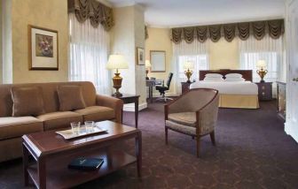 Spacious family room with king size bed and working station at the Drake.