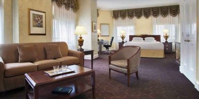 Spacious family room with king size bed and working station at the Drake.