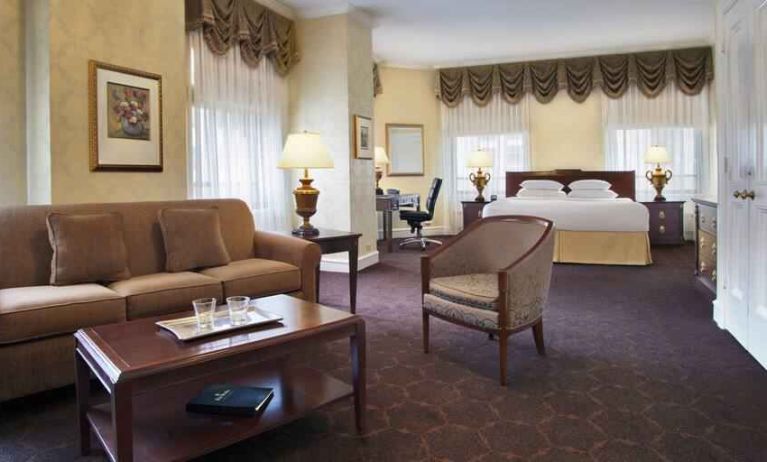 Spacious family room with king size bed and working station at the Drake.