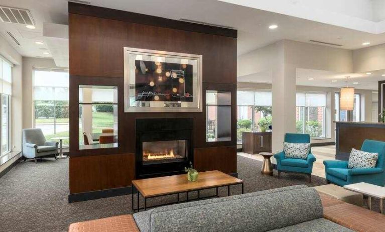 Beautiful workspace by the fireplace in a hotel lobby at the Hilton Garden Inn Silver Spring White Oak.