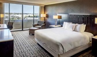 Comfortable king suite with city view at the Hilton Sacramento-Arden West.