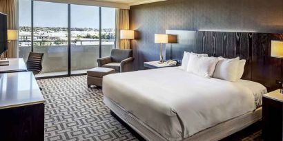 Comfortable king suite with city view at the Hilton Sacramento-Arden West.