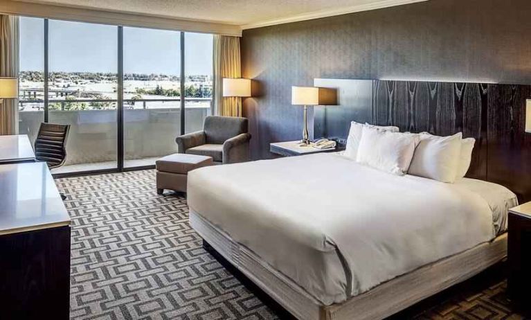 Comfortable king suite with city view at the Hilton Sacramento-Arden West.