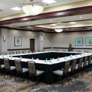 Meeting room with square conference table at the Hilton Sacramento-Arden West.