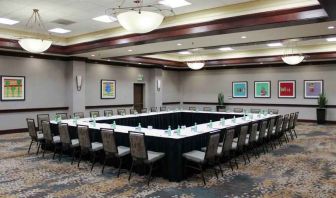 Meeting room with square conference table at the Hilton Sacramento-Arden West.