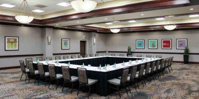 Meeting room with square conference table at the Hilton Sacramento-Arden West.