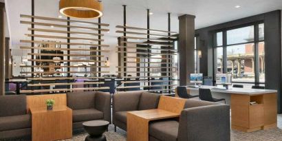 Elegant workspace with tables, lounges and chairs at the DoubleTree by Hilton Canton Downtown.