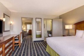 Spacious king suite with desk at the Embassy Suites by Hilton San Francisco Airport Waterfront.