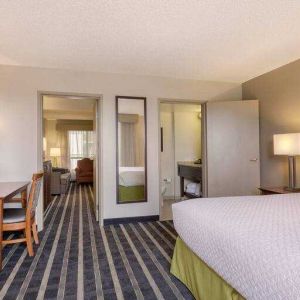 Spacious king suite with desk at the Embassy Suites by Hilton San Francisco Airport Waterfront.