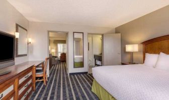 Spacious king suite with desk at the Embassy Suites by Hilton San Francisco Airport Waterfront.