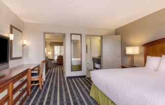 Spacious king suite with desk at the Embassy Suites by Hilton San Francisco Airport Waterfront.