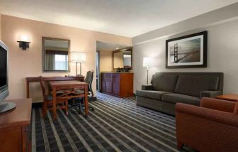 Comfortable living room in a hotel suite at the Embassy Suites by Hilton San Francisco Airport Waterfront.