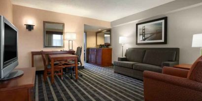 Comfortable living room in a hotel suite at the Embassy Suites by Hilton San Francisco Airport Waterfront.