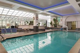 Relaxing indoor pool area at the Embassy Suites by Hilton San Francisco Airport Waterfront.