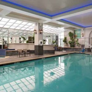 Relaxing indoor pool area at the Embassy Suites by Hilton San Francisco Airport Waterfront.