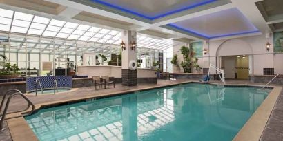 Relaxing indoor pool area at the Embassy Suites by Hilton San Francisco Airport Waterfront.