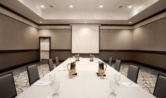 Meeting room with square table at the Embassy Suites by Hilton San Francisco Airport Waterfront.