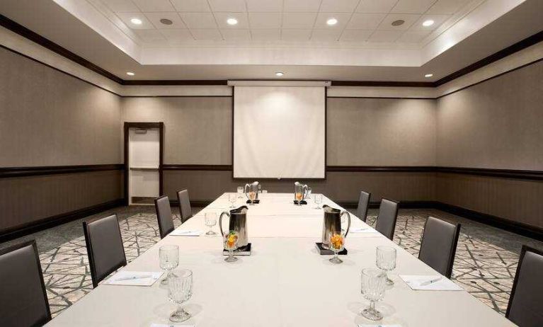 Meeting room with square table at the Embassy Suites by Hilton San Francisco Airport Waterfront.