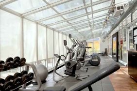 Bright fitness center at the Embassy Suites by Hilton San Francisco Airport Waterfront.