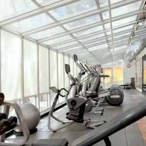 Bright fitness center at the Embassy Suites by Hilton San Francisco Airport Waterfront.