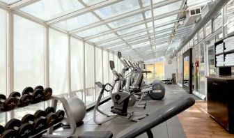 Bright fitness center at the Embassy Suites by Hilton San Francisco Airport Waterfront.