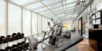 Bright fitness center at the Embassy Suites by Hilton San Francisco Airport Waterfront.